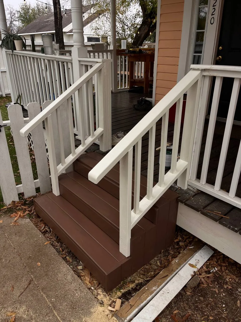Composite deck stairs with white railings Cedar Park TX