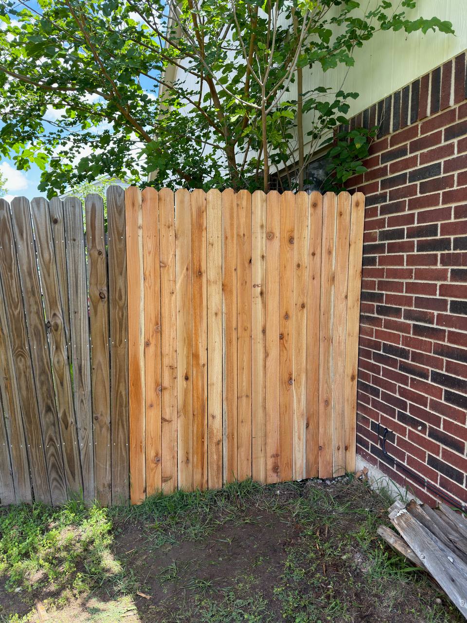 Cedar privacy fence section replacement next to brick home Cedar Park TX