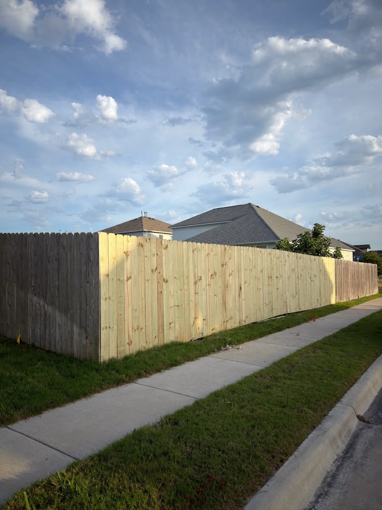 New cedar privacy fence installation along sidewalk Cedar Park TX