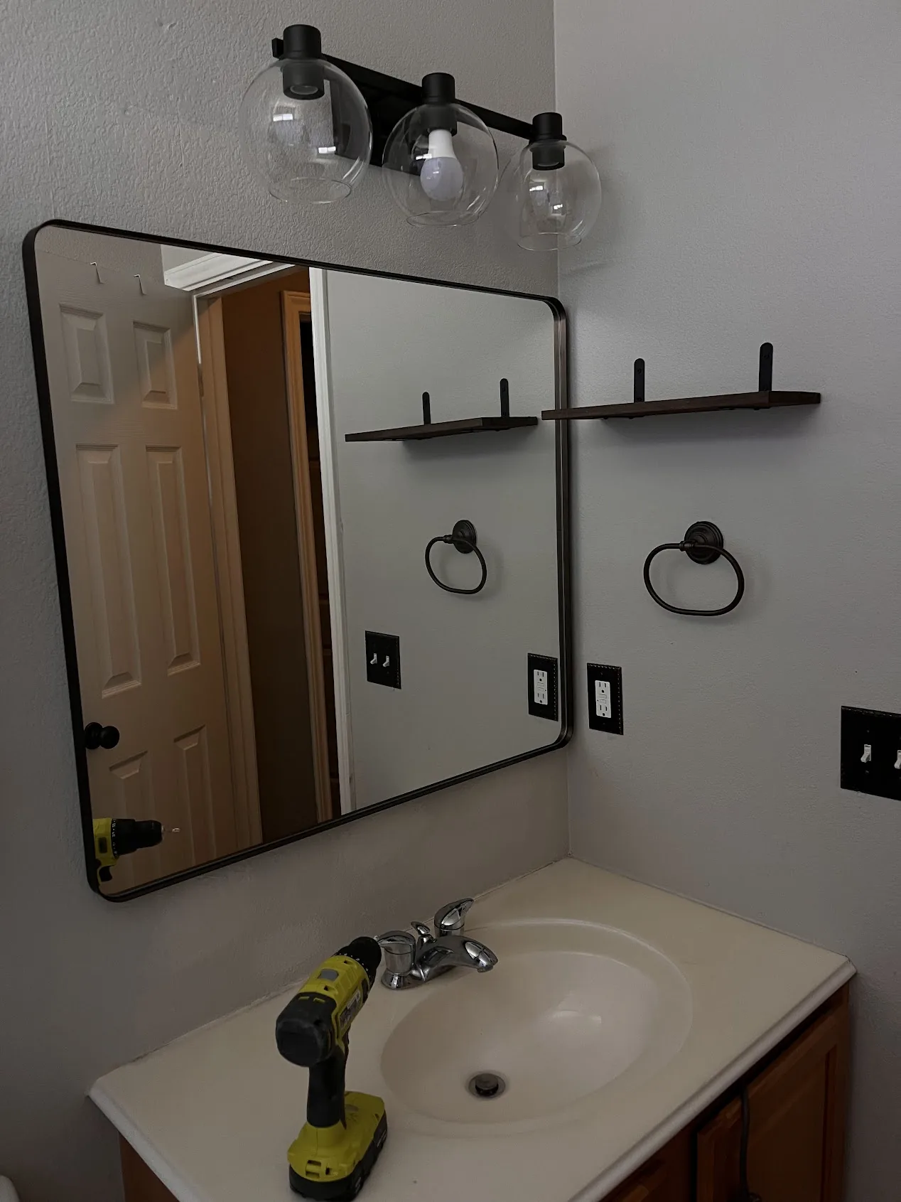 Bathroom mirror and floating shelf installation Cedar Park TX