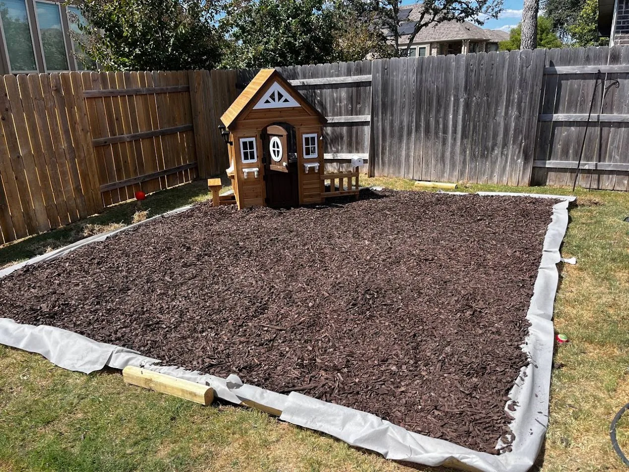 Kids play area mulch installation Cedar Park TX