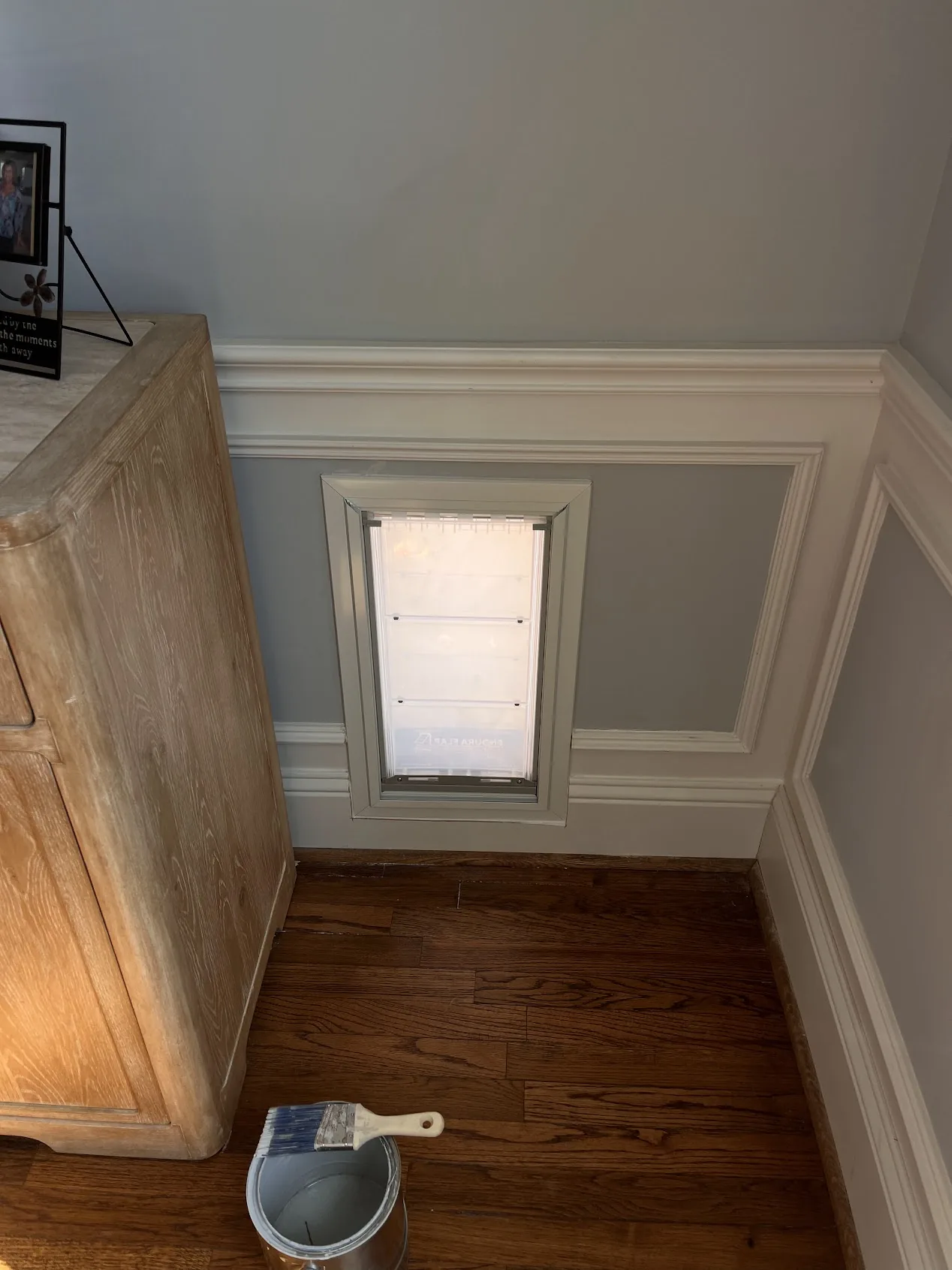 Pet door installation interior wall with wainscoting Cedar Park TX