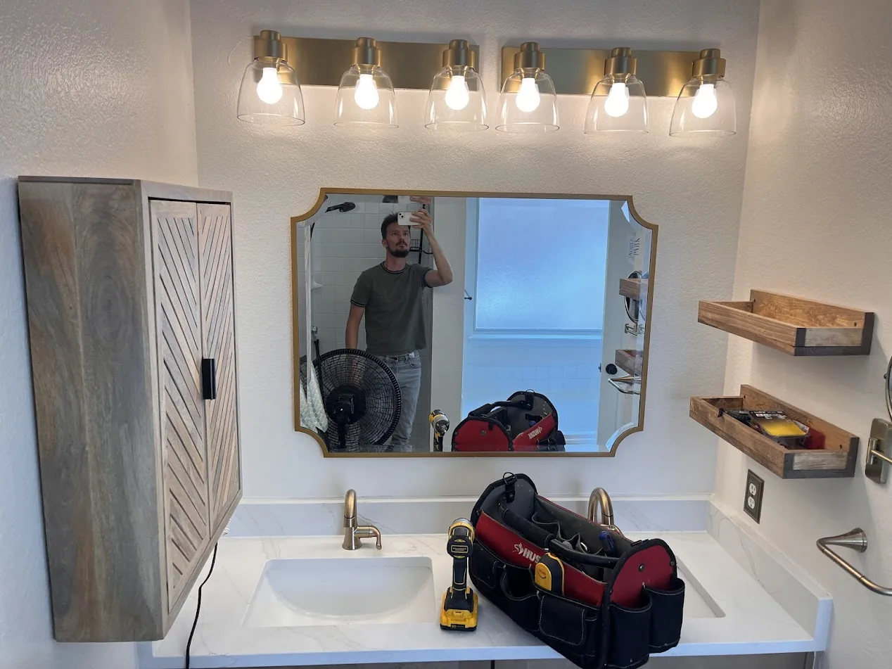 Custom wood bathroom cabinet and floating shelves