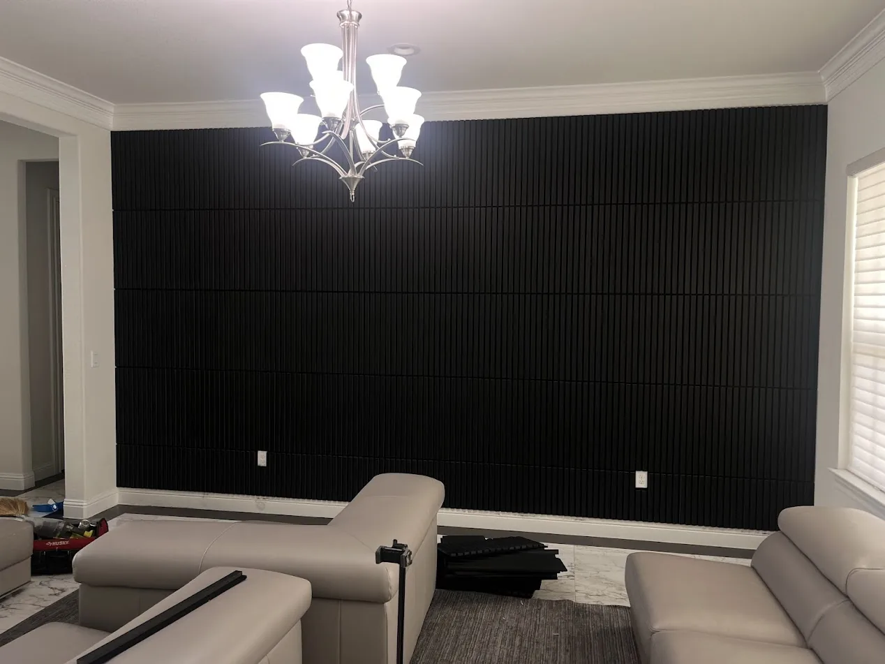 Black wood slat accent wall installation