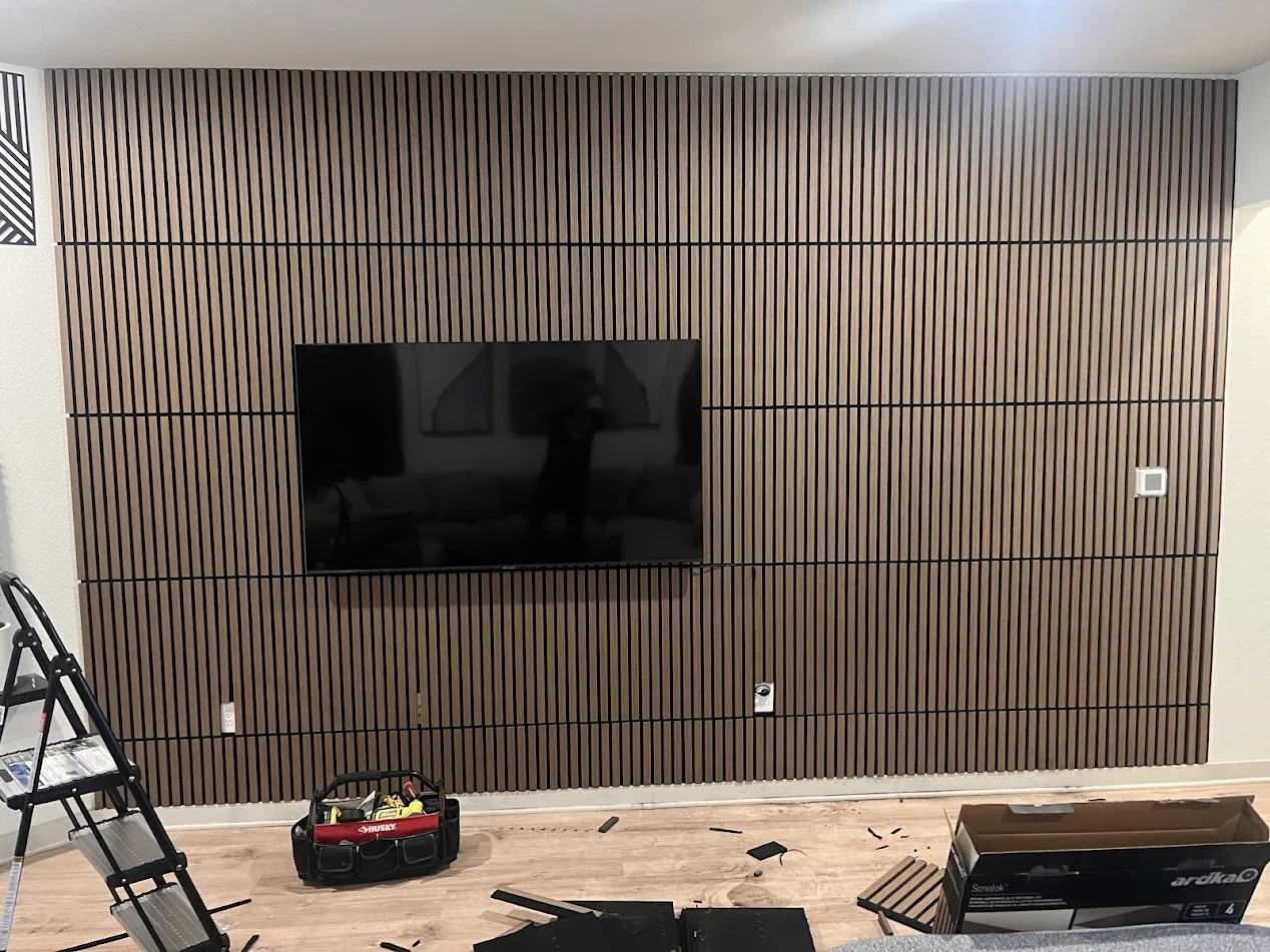 Natural wood slat accent wall with TV mount